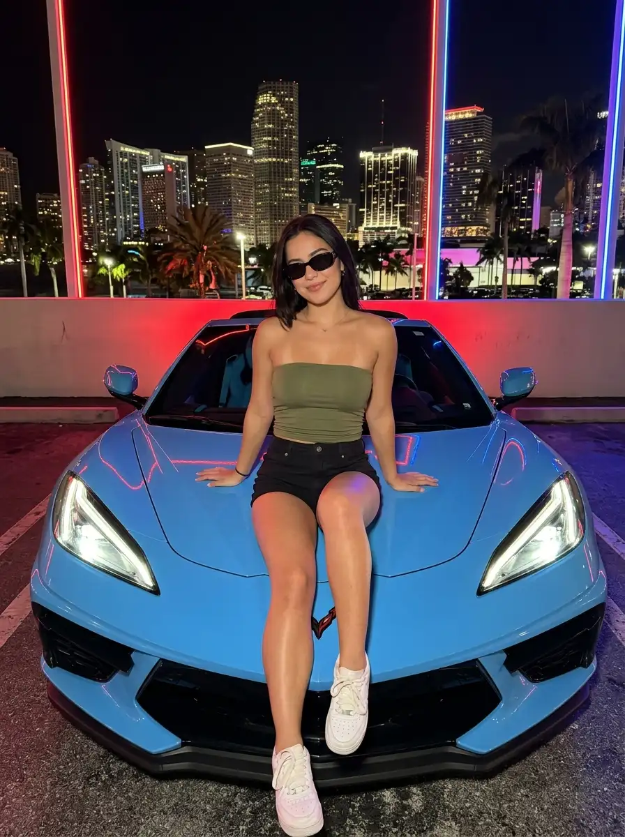 Woman_sitting_on_car_202607141625